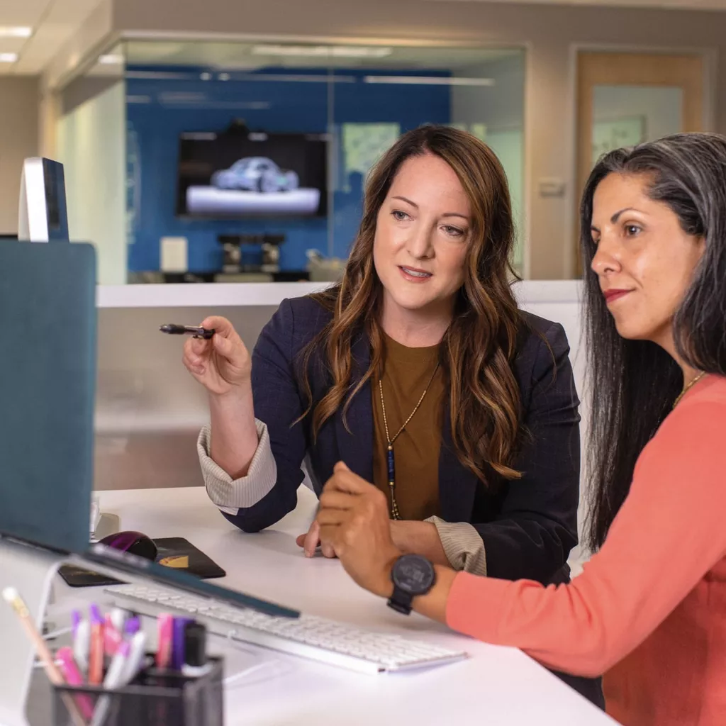 Two women being creative at work.