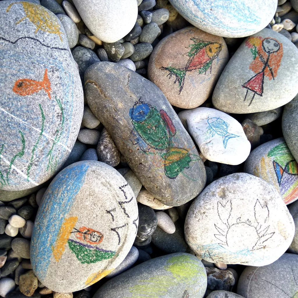 Pebbles with children's drawings on them.