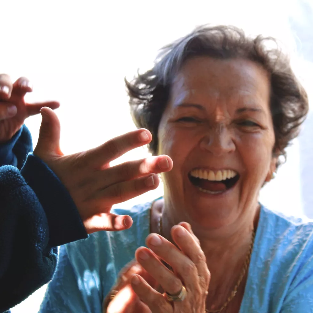 A very happy lady, laughing.