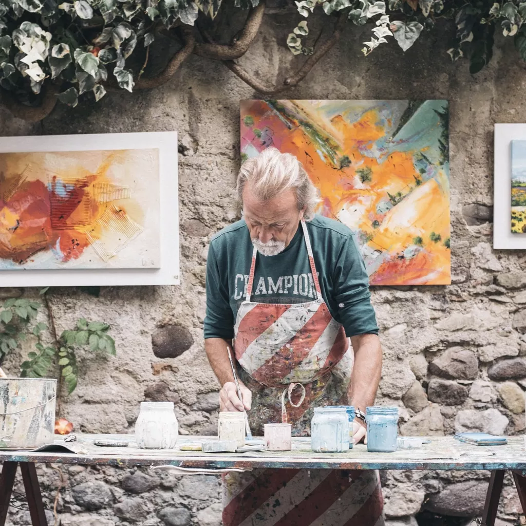 A man painting for his work.