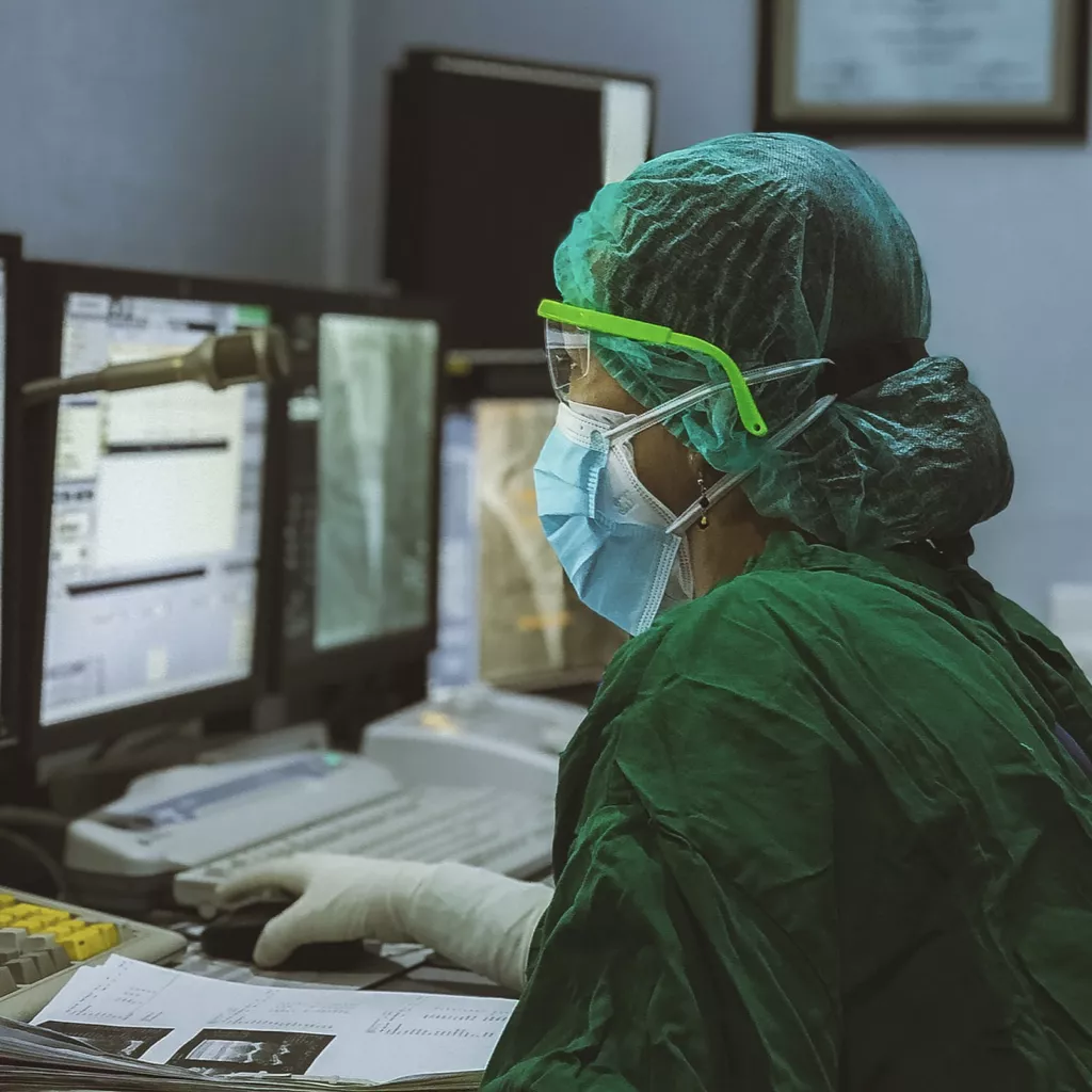 A professional person working in a surgery.