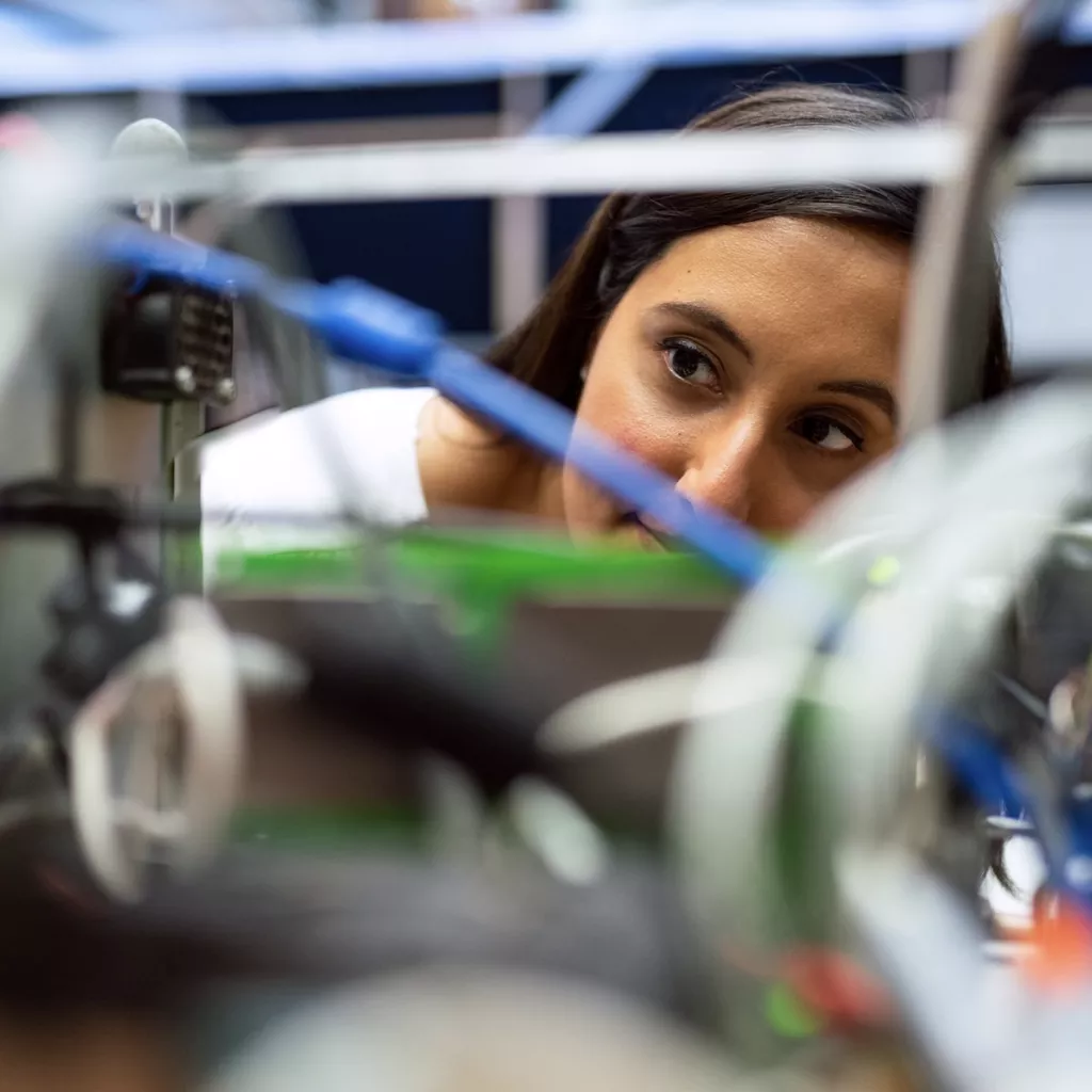 A lady performing a scientific test.