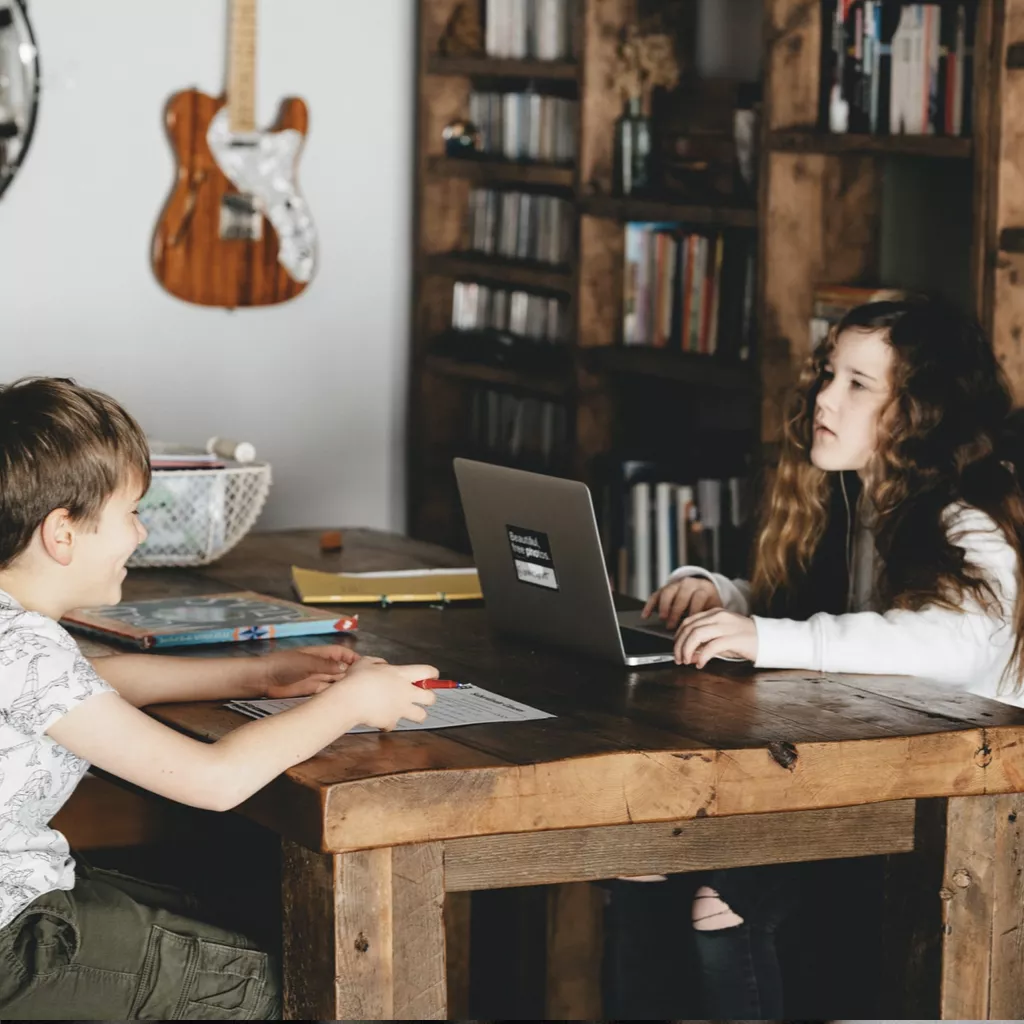 Children doing their homework after school.