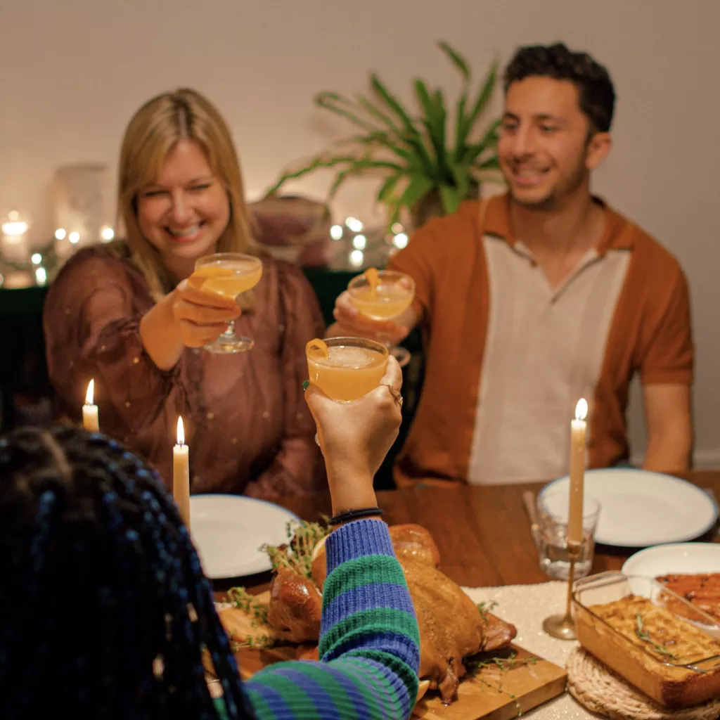 Happy family, celebrating at dinner.