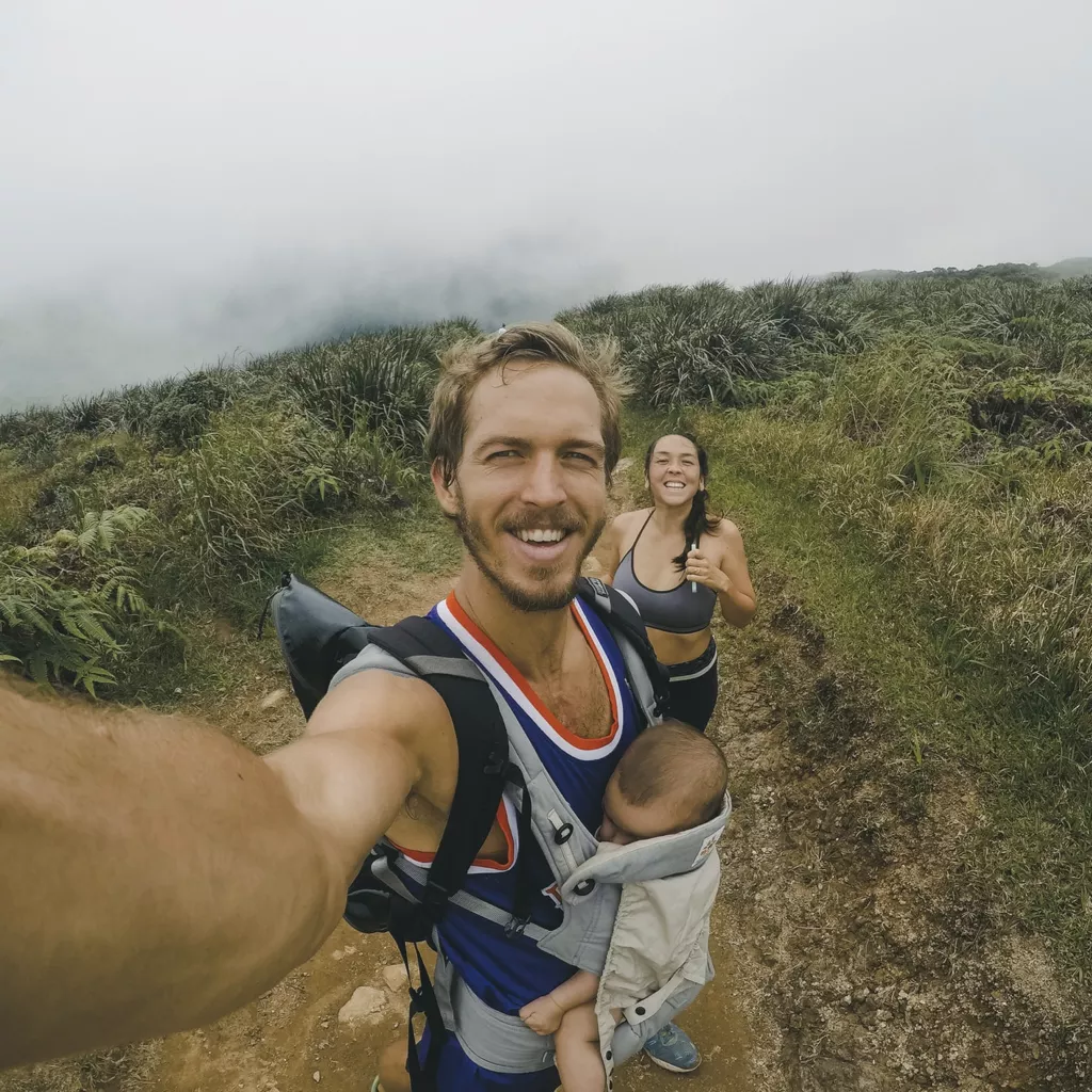 An unusual family, going running with their baby.