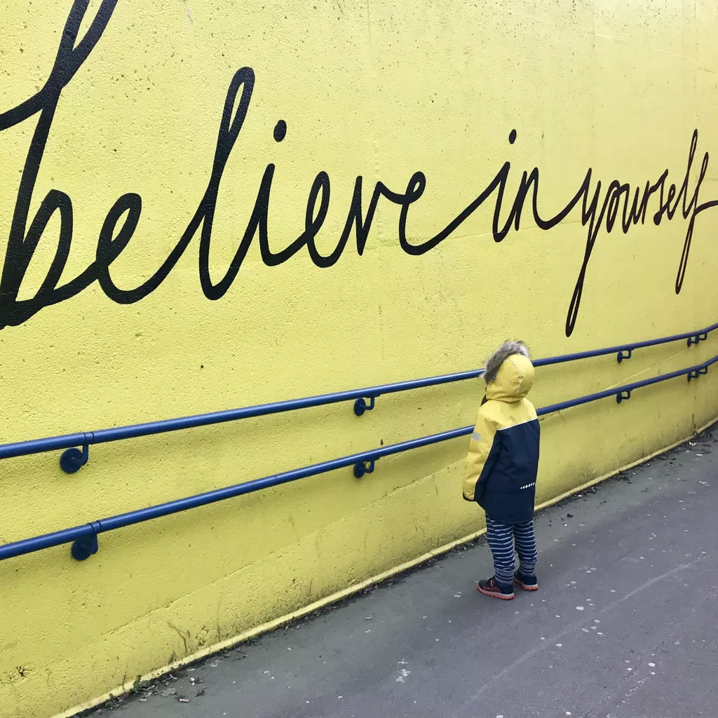 A sign written on the wall: "Believe in yourself".