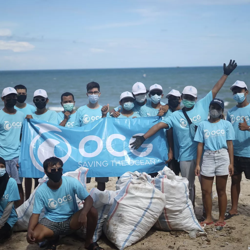 A group of people from a charity that's collecting rubbish from the ocean.