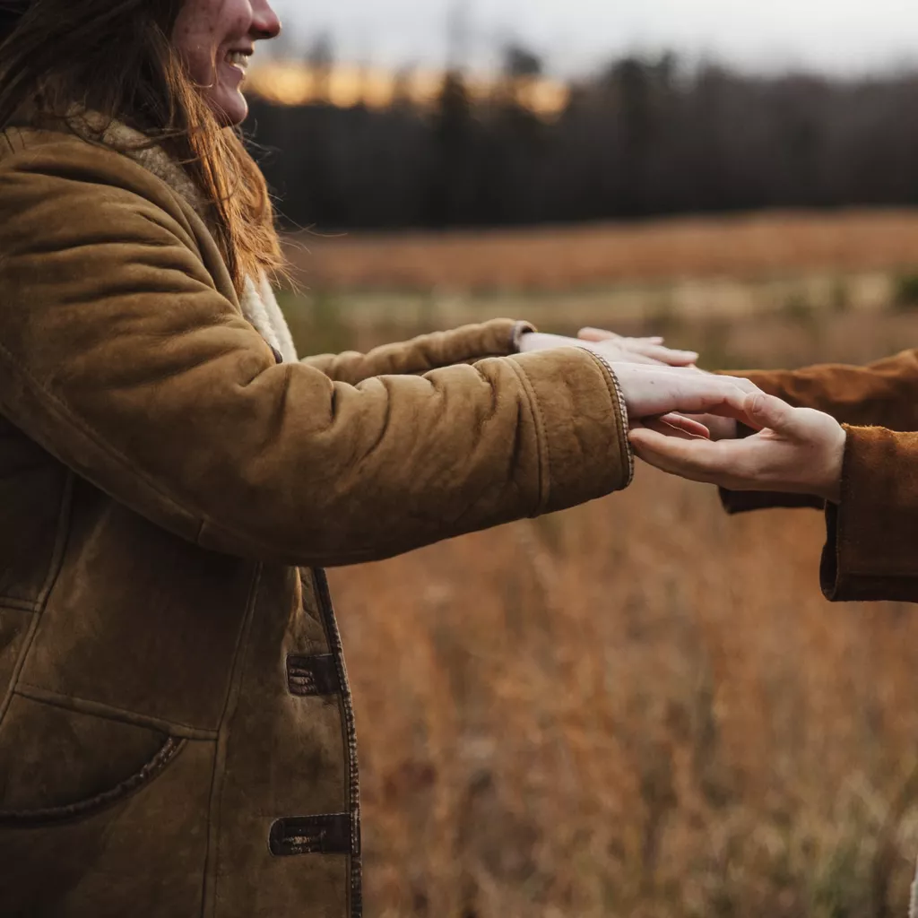 A couple holding hands.