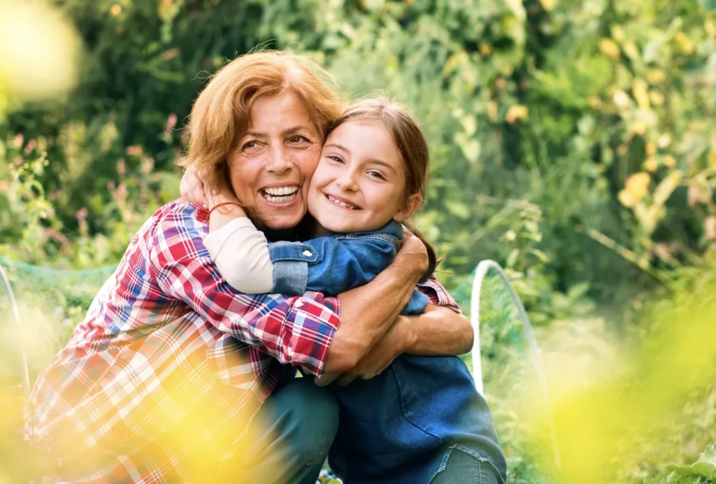 A mother shows her support for her daughter with a big hug.