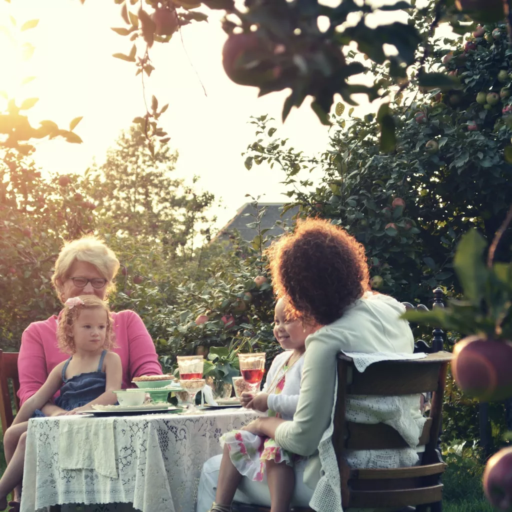 A family having a meal in their garden.