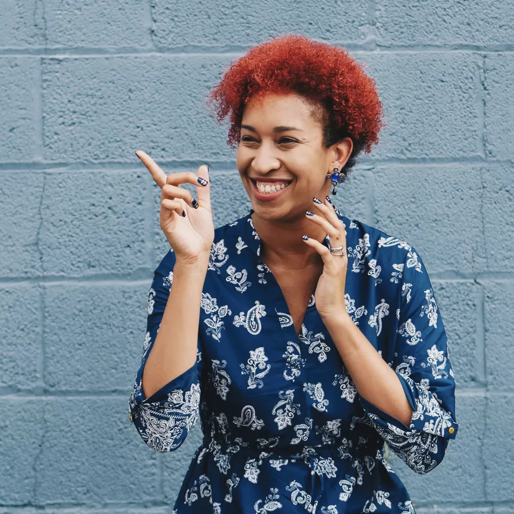 A lady looking delighted about something.