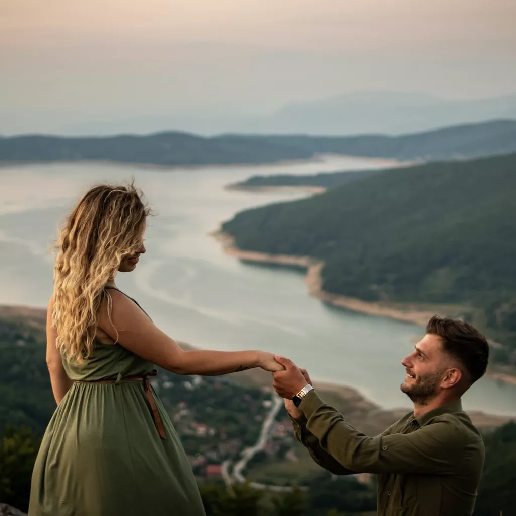 A man down on his knee proposing to his partner.