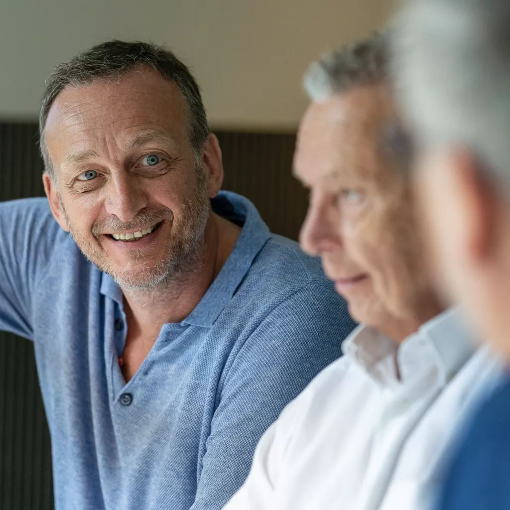 Several men talking.