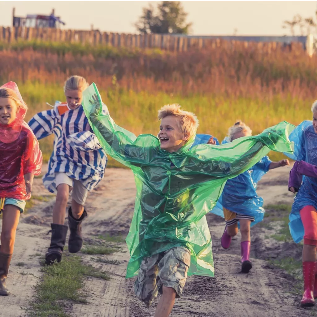 Children running in the rain.