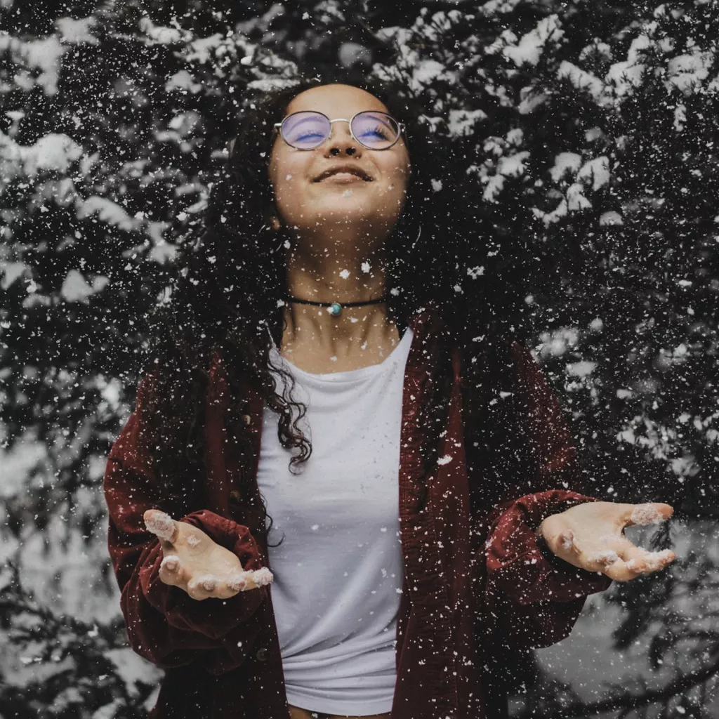 Young lady enjoying the snow.