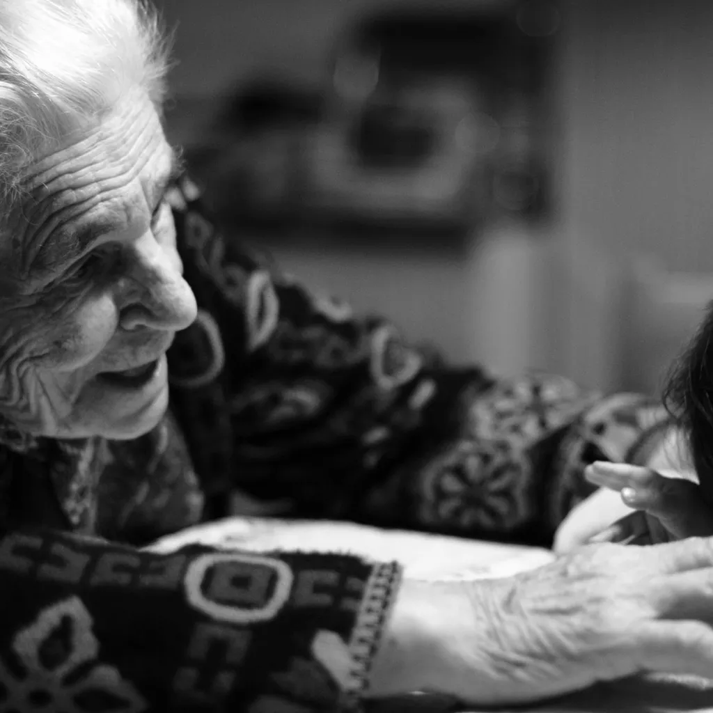 A grandmother looking after her granddaughter.