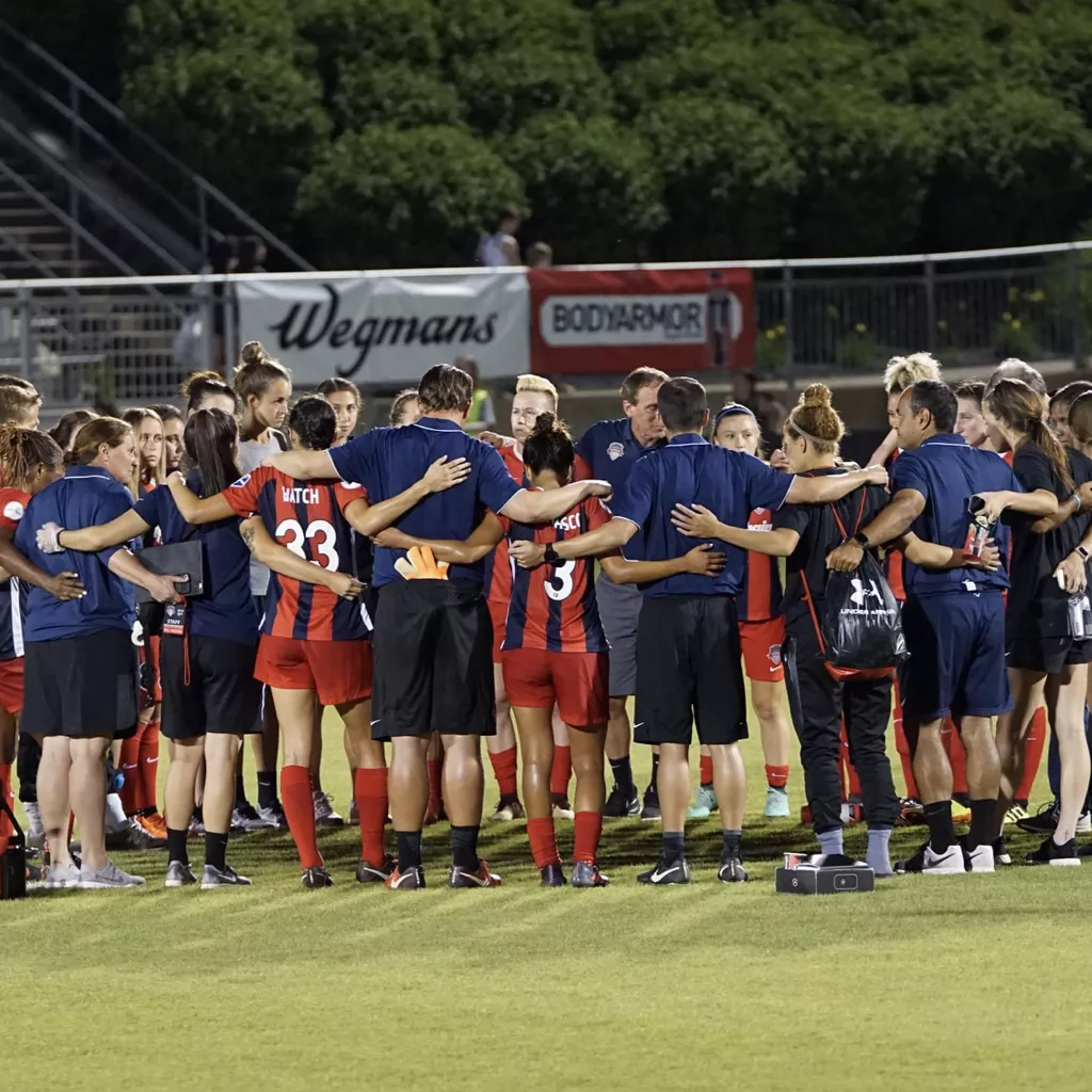 A football team gathered together for a pep talk.