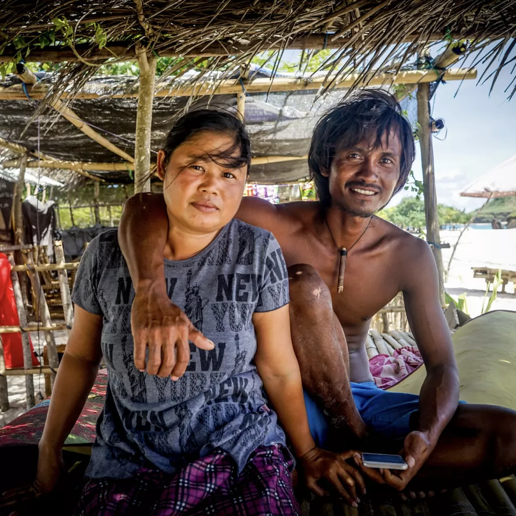 An Asian-looking couple in a travel location.