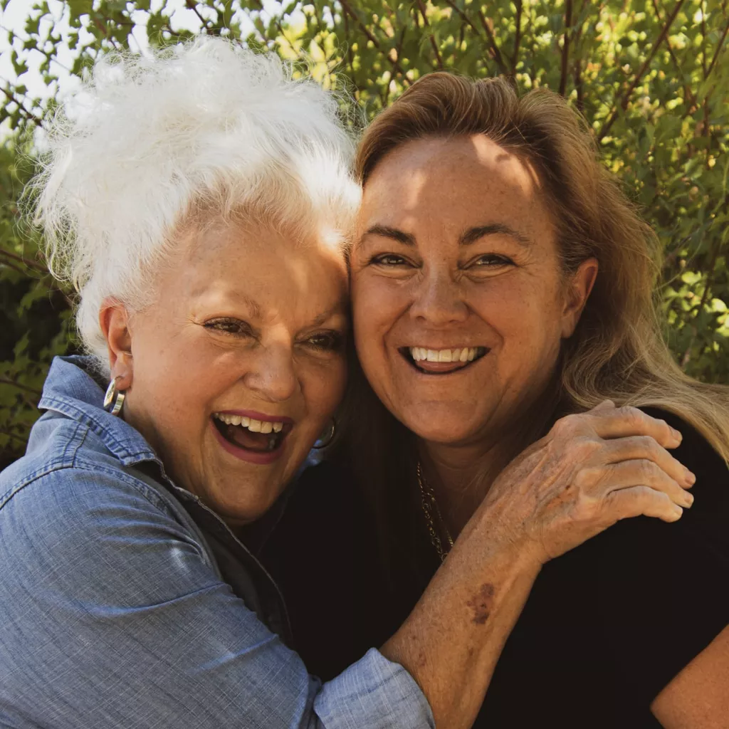 Mother and daughter smiling.