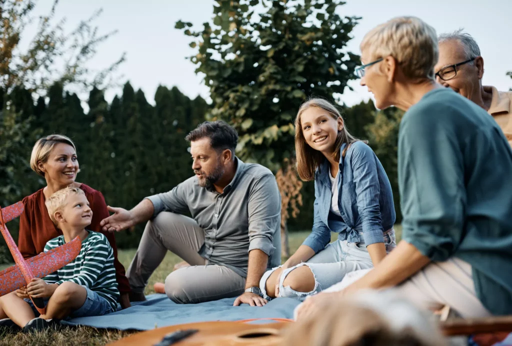 A family of all generations deep in conversation.